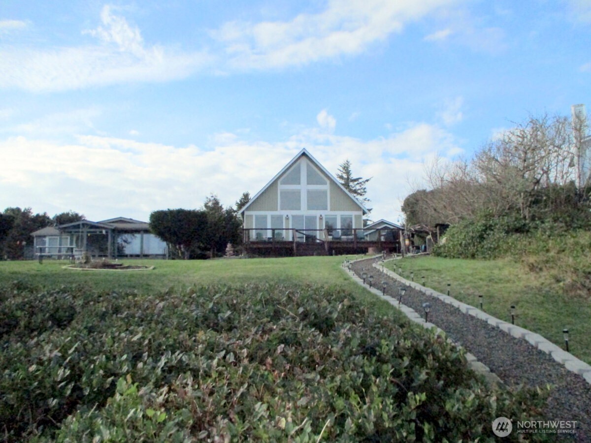 369 North Razor Clam Drive Southwest Ocean Shores, WA 98569 - Photo 27 of 27 a view of a house with a big yard and large trees