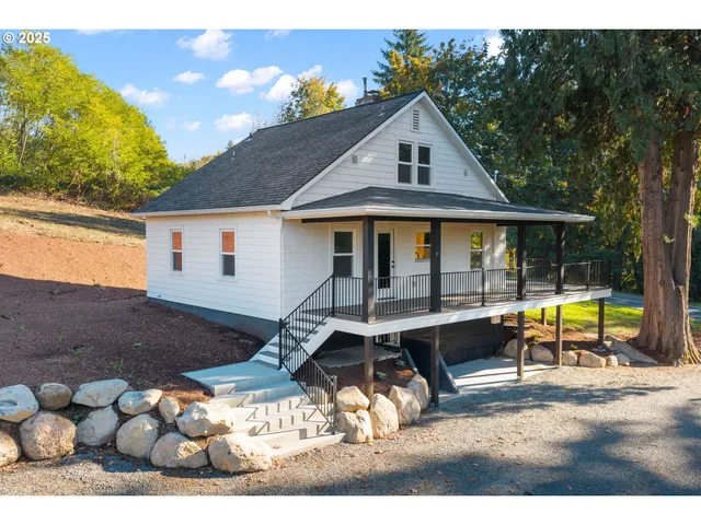 a view of house with swimming pool outdoor seating