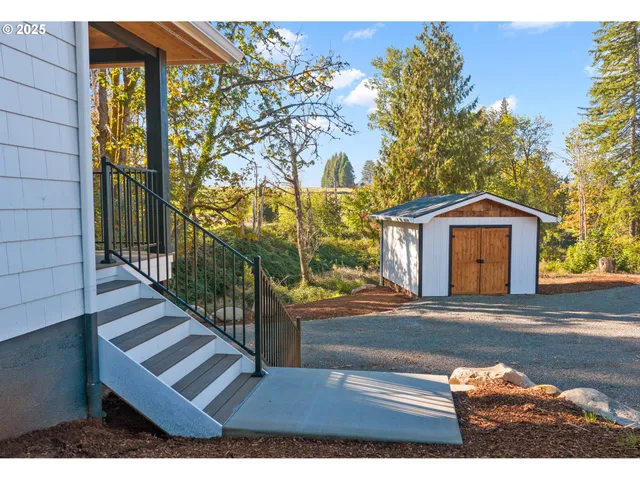 a view of front door of house with wooden floor