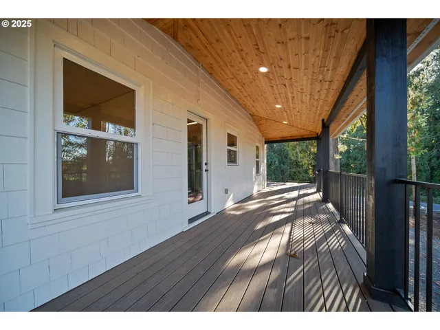 a living room with furniture rug and window