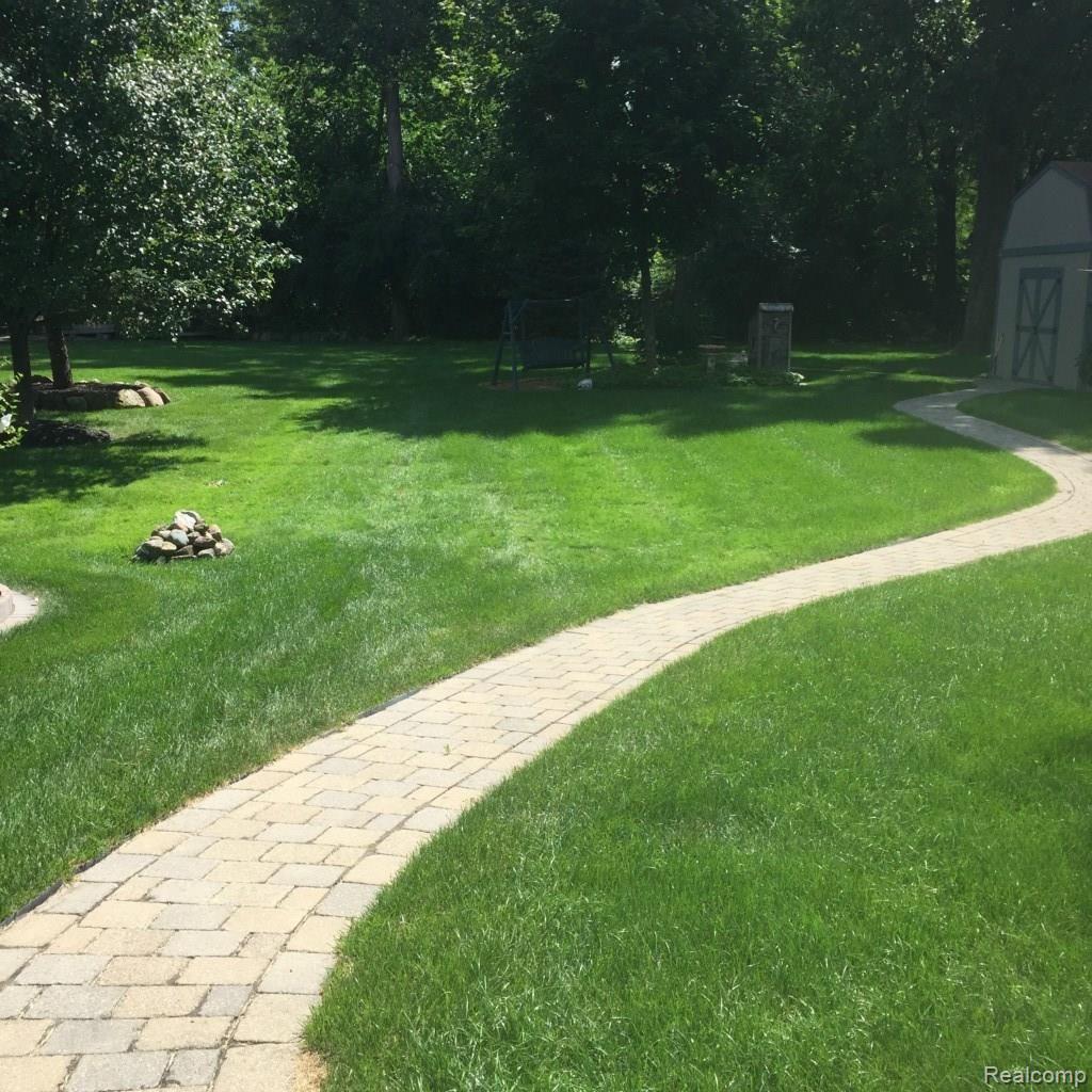 15134 Merriman Road Livonia, MI 48154 - Photo 28 of 34 WALKWAY TO SHED