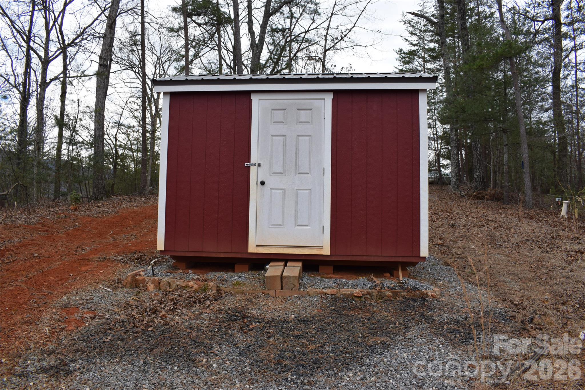 172 Winter Lane Mill Spring, NC 28756 - Photo 19 of 20 a view of backyard with large trees and wooden fence