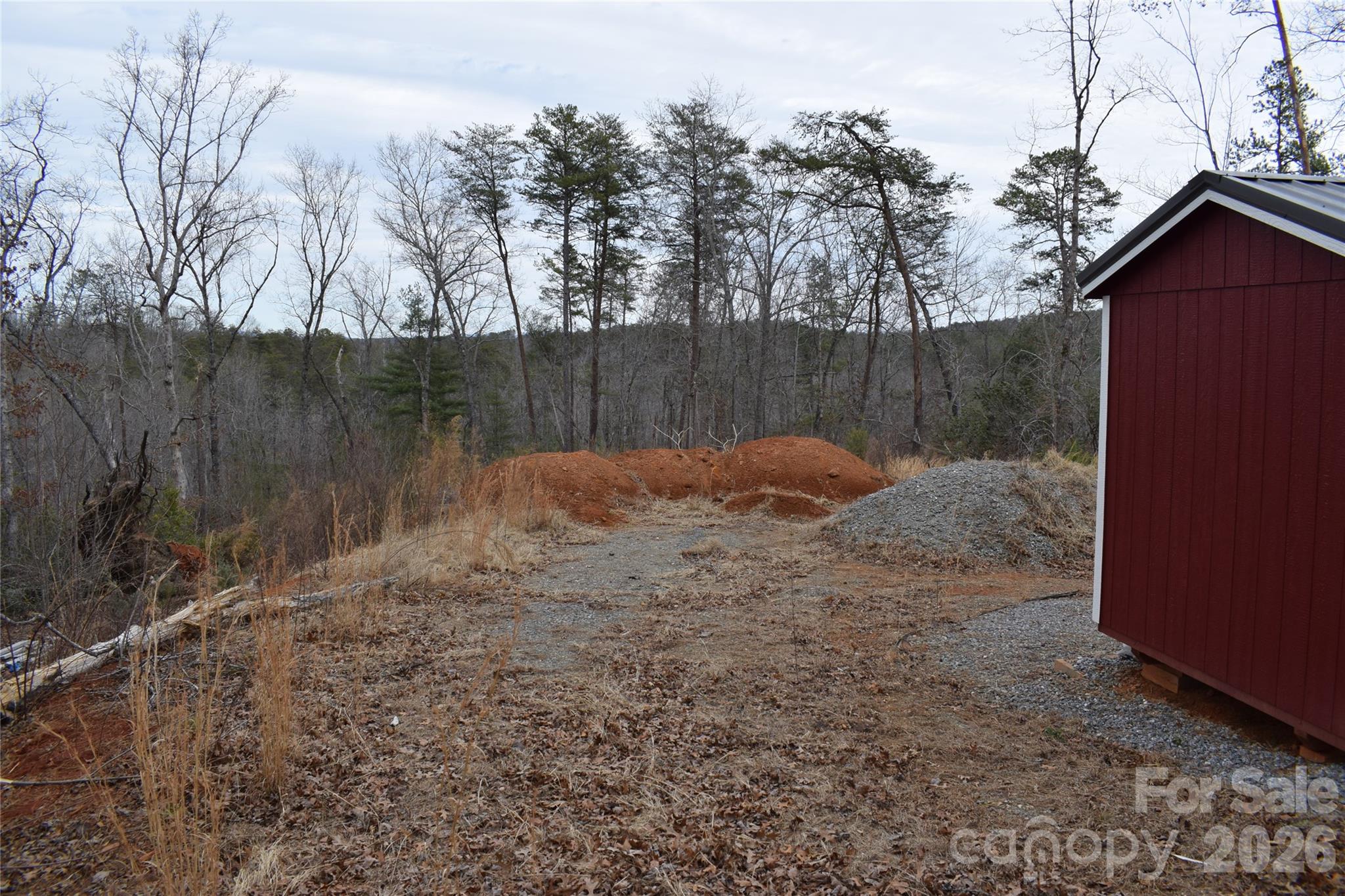 172 Winter Lane Mill Spring, NC 28756 - Photo 2 of 20 a backyard of a house with lots of green space