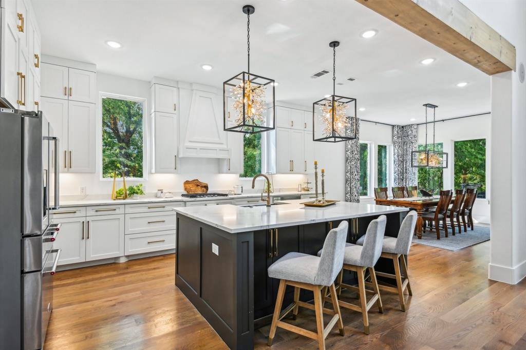 478 Polly Road Sunnyvale, TX 75182 - Photo 11 of 40 Kitchen featuring freestanding refrigerator, recessed lighting, light countertops, white cabinets, and a chandelier