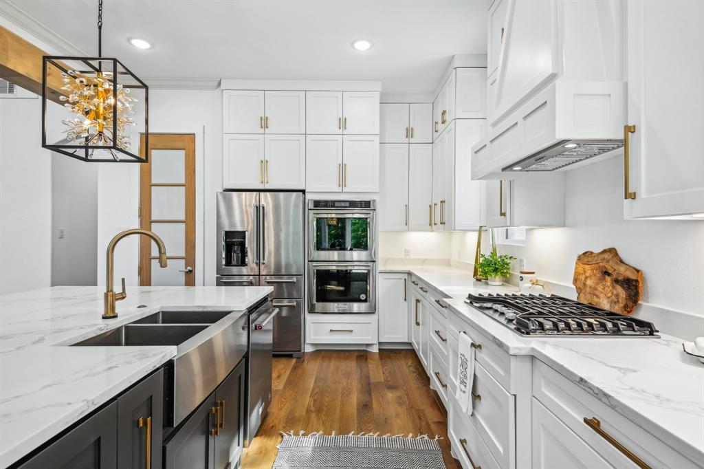 478 Polly Road Sunnyvale, TX 75182 - Photo 12 of 40 Kitchen featuring white cabinets, stainless steel appliances, dark cabinets, custom range hood, and recessed lighting