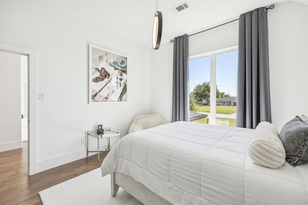 478 Polly Road Sunnyvale, TX 75182 - Photo 25 of 40 Bedroom featuring wood finished floors and baseboards