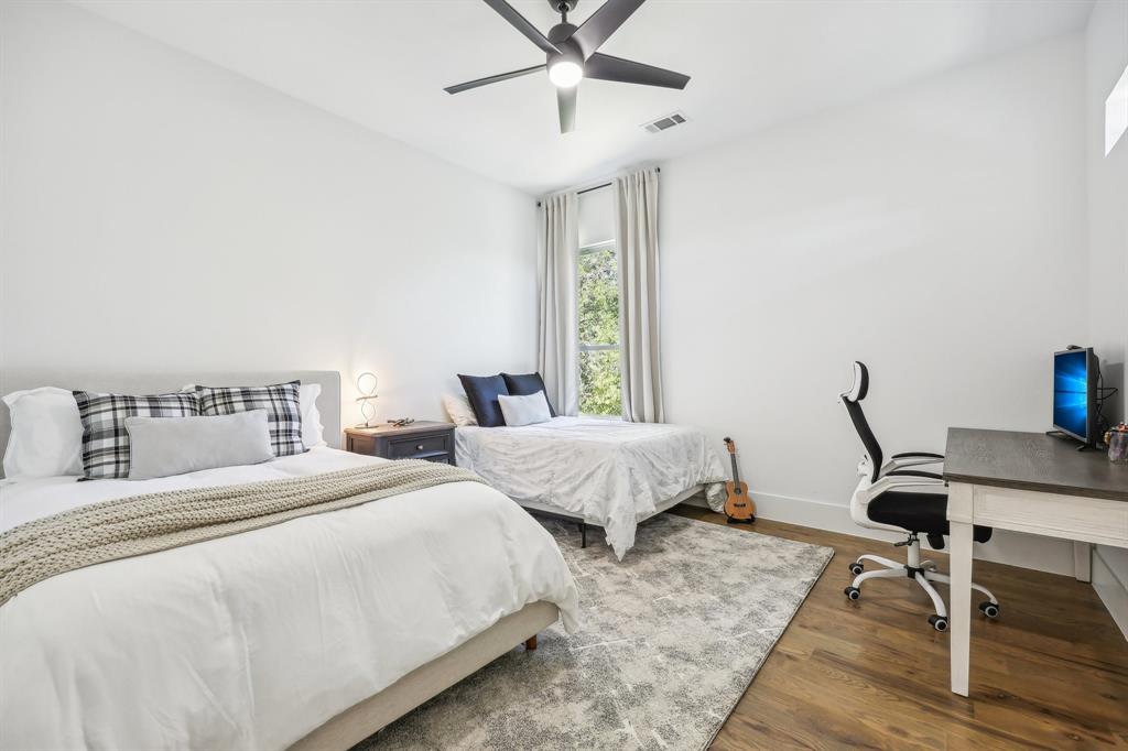 478 Polly Road Sunnyvale, TX 75182 - Photo 29 of 40 Bedroom featuring wood finished floors, an office area, and a ceiling fan
