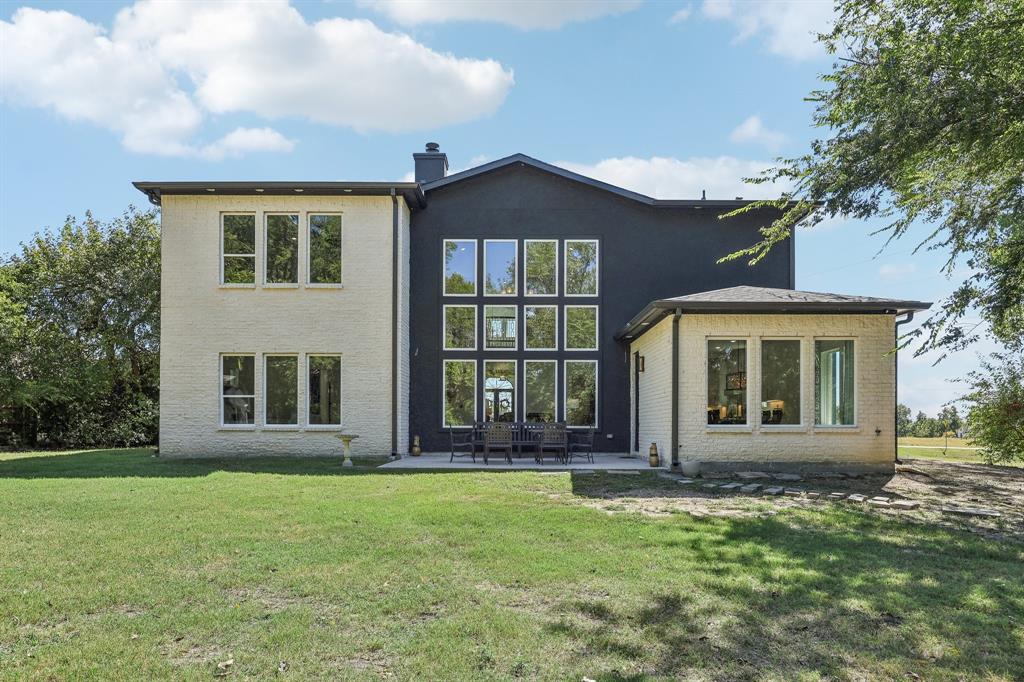 478 Polly Road Sunnyvale, TX 75182 - Photo 35 of 40 Rear view of house with brick siding, a chimney, a yard, and a patio area