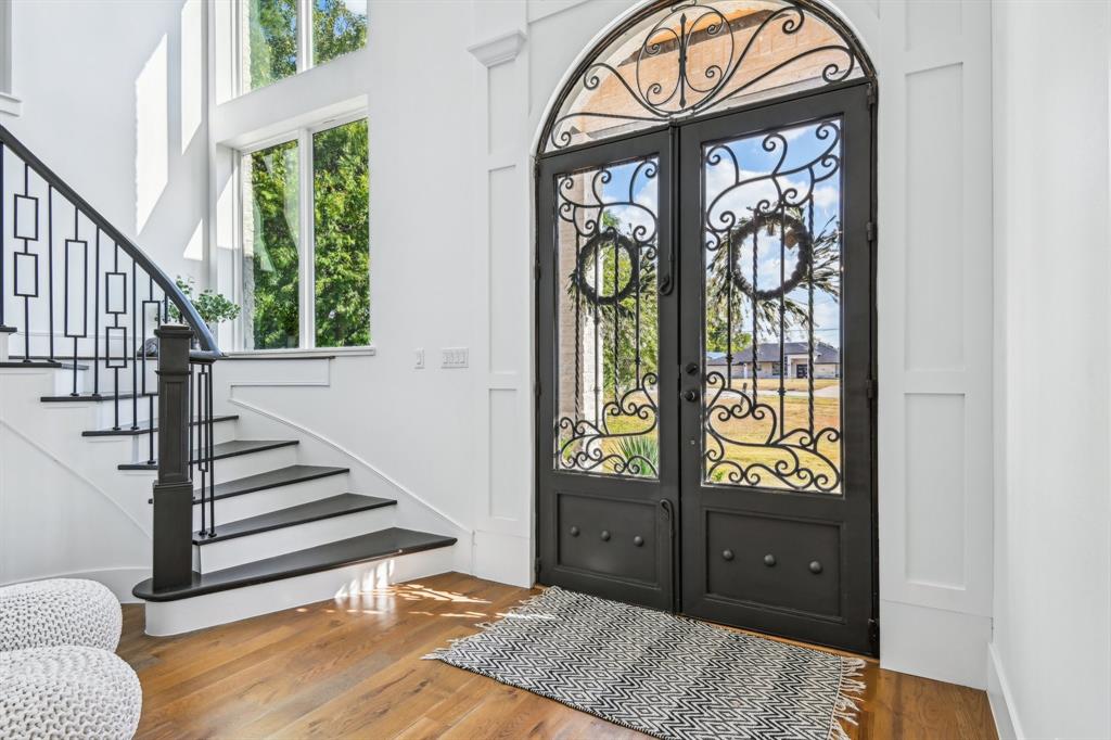 478 Polly Road Sunnyvale, TX 75182 - Photo 6 of 40 Entryway with stairway, french doors, wood finished floors, and a high ceiling