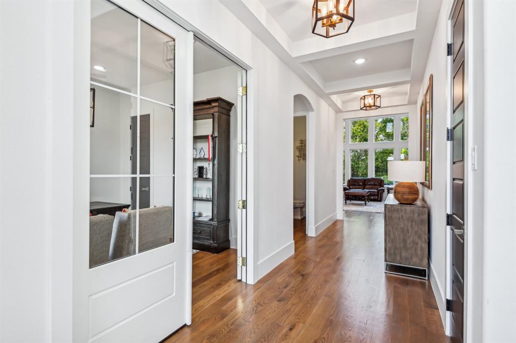 478 Polly Road Sunnyvale, TX 75182 - Photo 7 of 40 Entrance foyer with a chandelier, arched walkways, dark wood-style floors, and recessed lighting