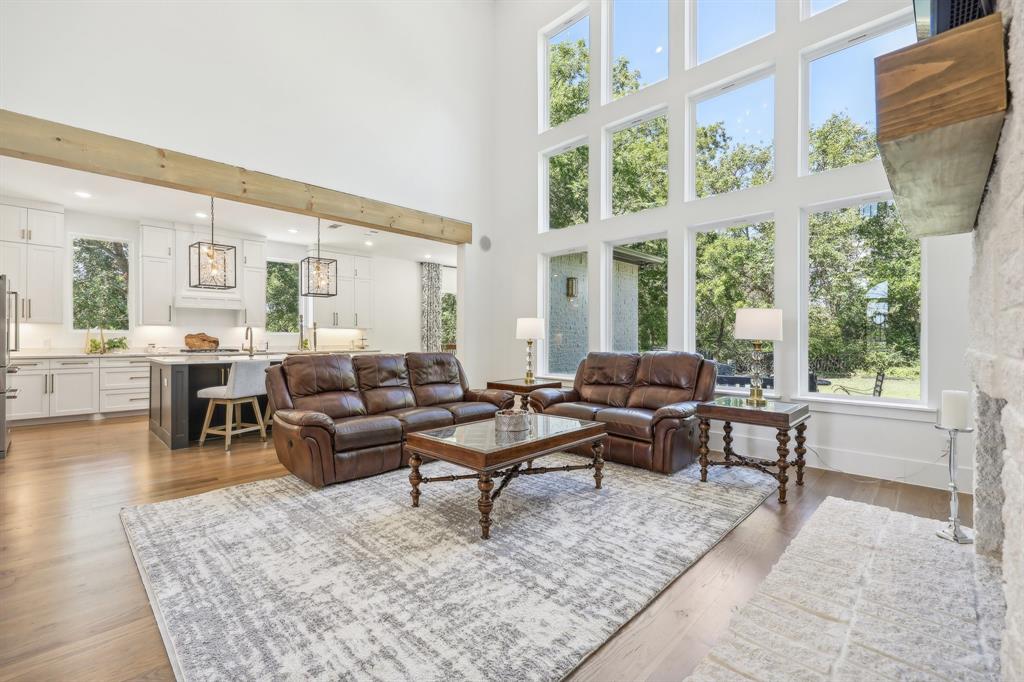 478 Polly Road Sunnyvale, TX 75182 - Photo 10 of 40 Living room featuring a high ceiling and light wood-style floors