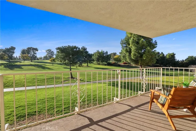 a view of a tennis court with a ocean view