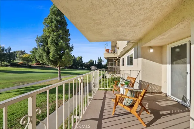 a view of balcony with furniture