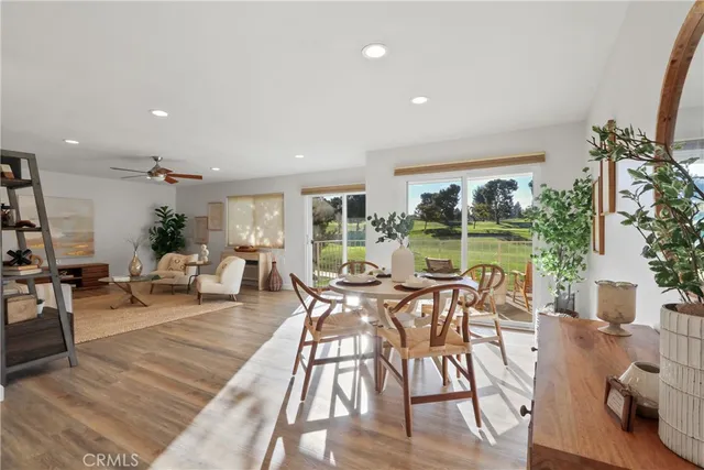 a view of a dining room with furniture window and wooden floor
