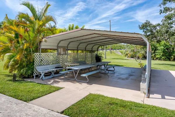 a backyard of a house with outdoor seating