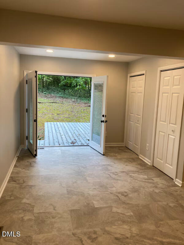 1505 Woodland Road Garner, NC 27529 - Photo 6 of 19 an empty room with a bed and large window