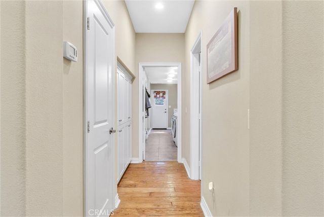 a spacious bathroom with a double vanity sink a mirror and a next to a window
