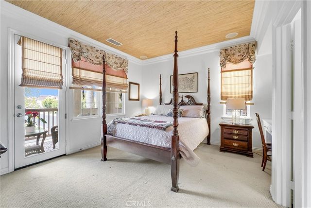 a bathroom with a granite countertop toilet sink and mirror