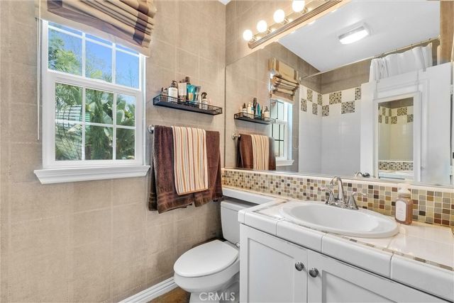 a floor to ceiling window with wooden floor