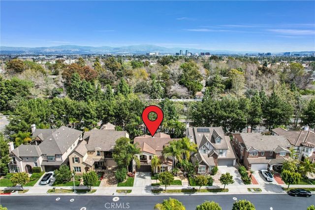 an aerial view of a city and mountain view in back