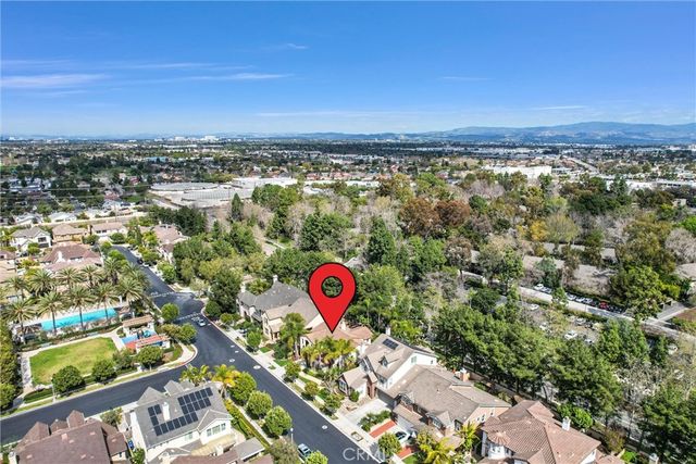 an aerial view of multi story residential apartment building with yard