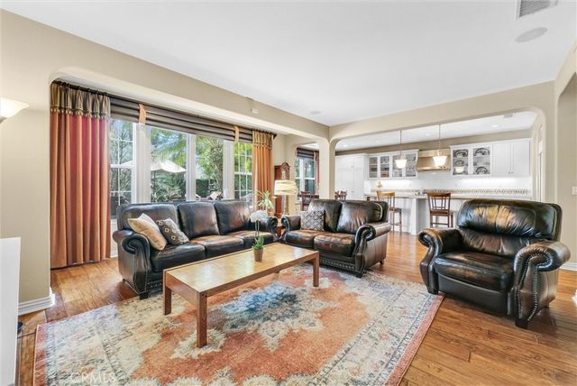 a view of a patio with chairs and table under an umbrella