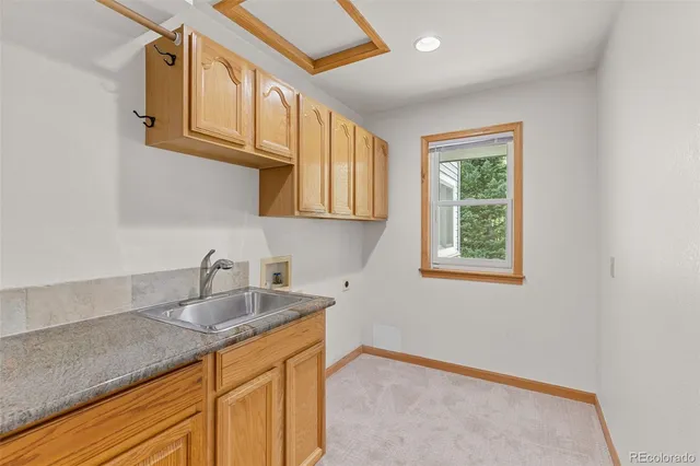 a kitchen with stainless steel appliances granite countertop a sink and cabinets