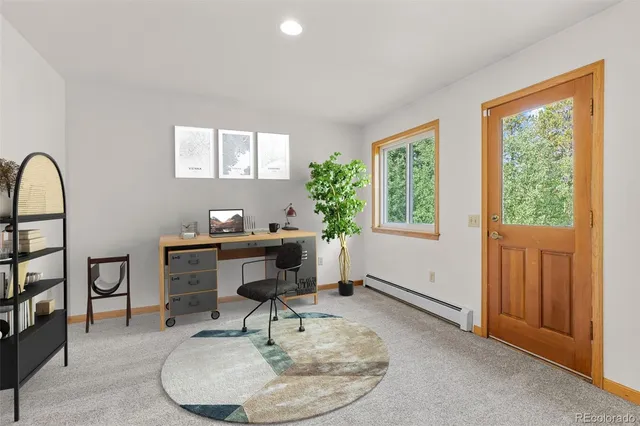 a workspace with furniture and window