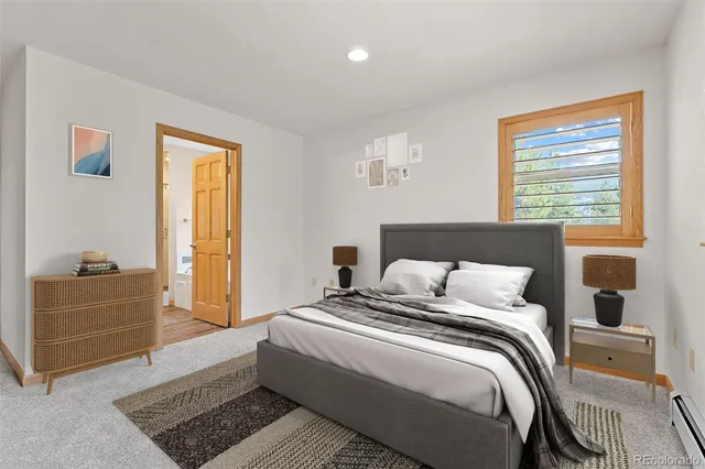 a bedroom with a bed and a dresser