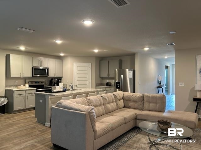 7409 Brompton Drive Foley, AL 36535 - Photo 3 of 18 Living room with light hardwood / wood-style floors