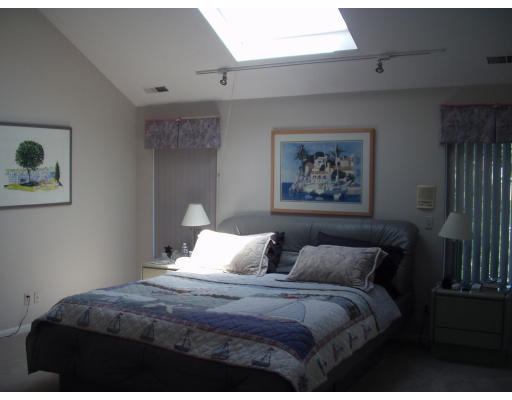 21 Richard Road Marblehead, MA 01945 - Photo 7 of 10 a bedroom with a bed and a painting on the wall