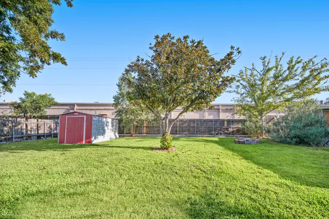 a house view with swimming pool in front of it