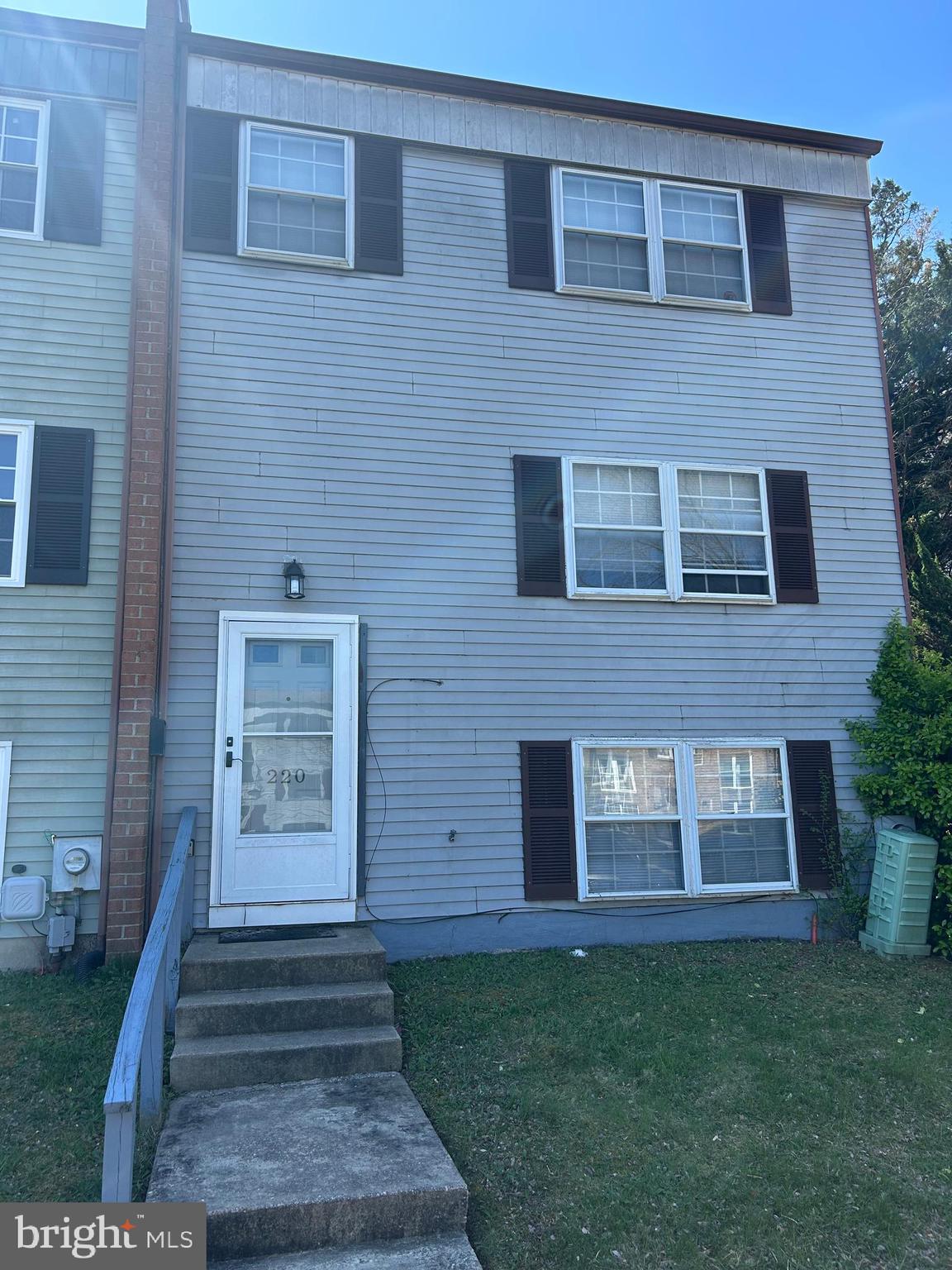 a brick building with a yard