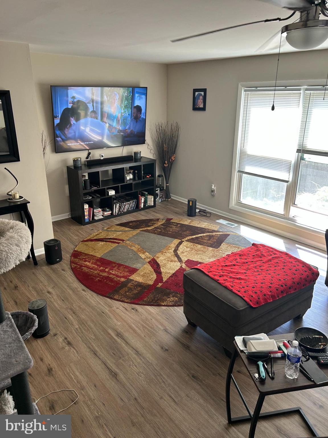 220 Whitherspoon Lane Newark, DE 19713 - Photo 4 of 6 a living room with furniture a flat screen tv and a table