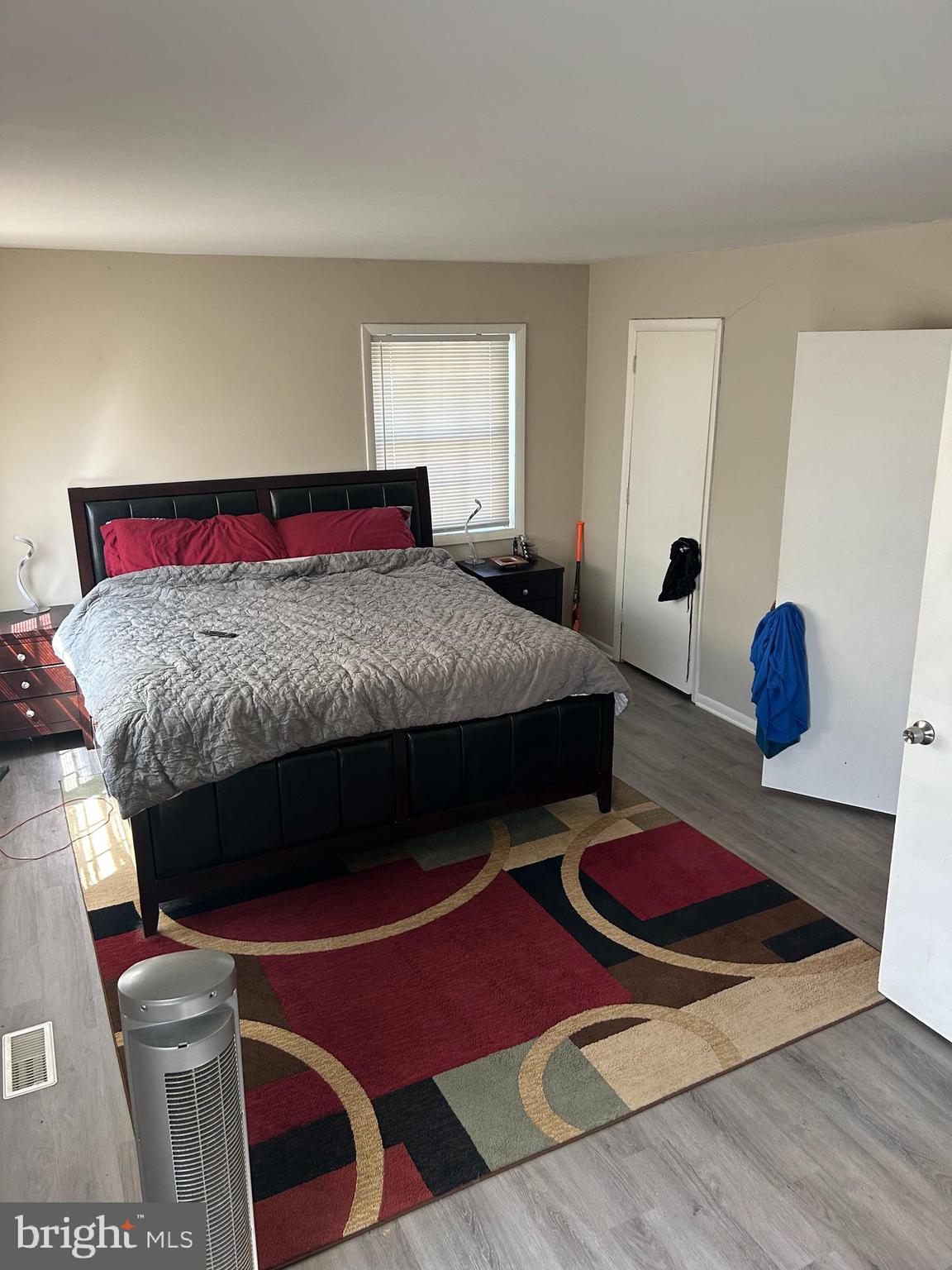 220 Whitherspoon Lane Newark, DE 19713 - Photo 5 of 6 a bedroom with a bed and a lamp