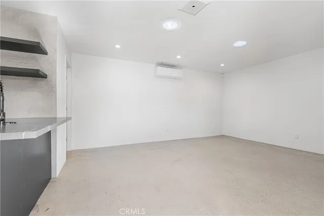 an empty room with a empty space and sink