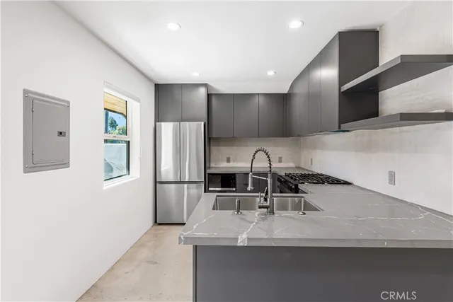 a bathroom with a sink a washer and dryer