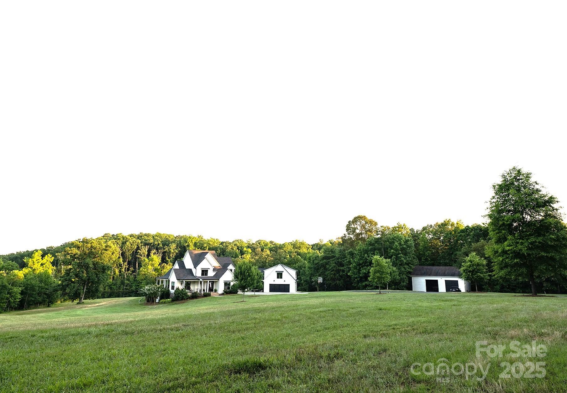 1632 Mission Road York, SC 29745 - Photo 3 of 5 a view of a grassy field with trees