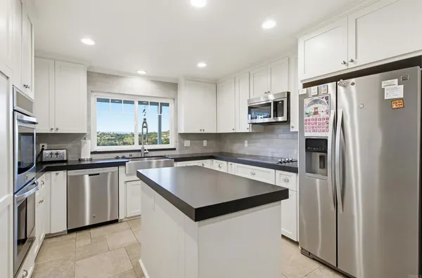 a bedroom with furniture and a chandelier