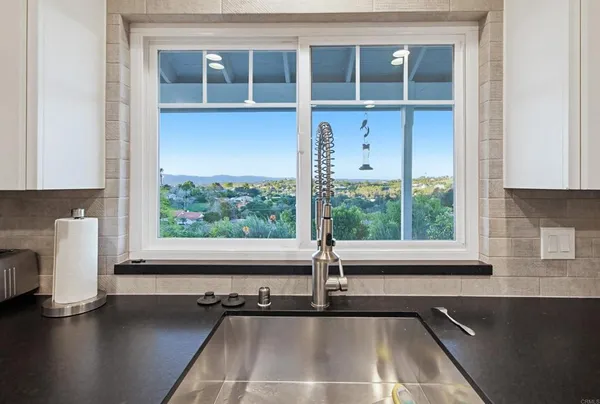 a bathroom with a double vanity sink and a bathtub