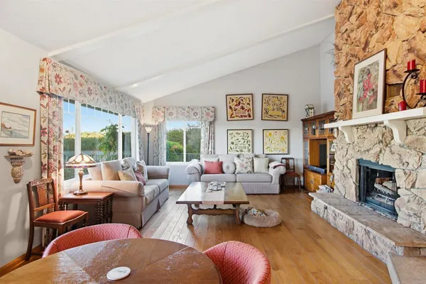 a view of a livingroom with furniture and a window