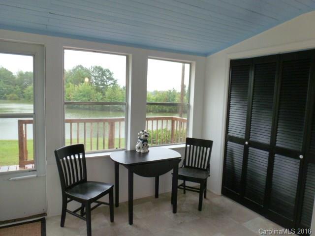 4852 Rowell Road Lancaster, SC 29720 - Photo 11 of 24 a view of a city from a dining room with furniture wooden floor and a potted plant