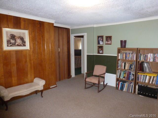 4852 Rowell Road Lancaster, SC 29720 - Photo 13 of 24 a living room with furniture and a book shelf