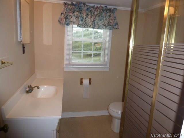 4852 Rowell Road Lancaster, SC 29720 - Photo 19 of 24 a bathroom with a toilet and a shower