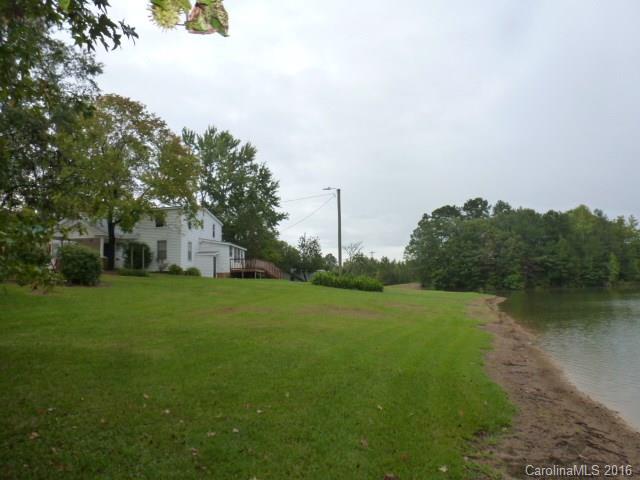 4852 Rowell Road Lancaster, SC 29720 - Photo 22 of 24 a view of a big house with a big yard and large trees
