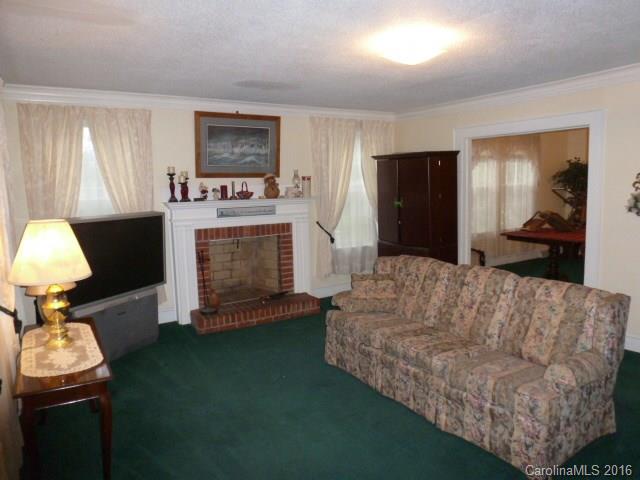 4852 Rowell Road Lancaster, SC 29720 - Photo 4 of 24 a living room with furniture and a fireplace