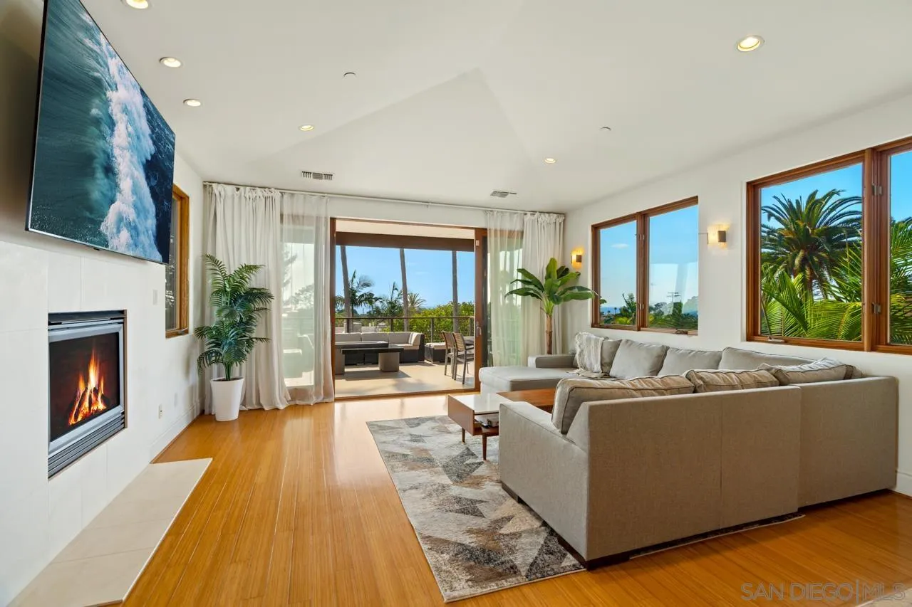 733 Stratford Drive Encinitas, CA 92024 - Photo 20 of 46 a living room with furniture and a fireplace