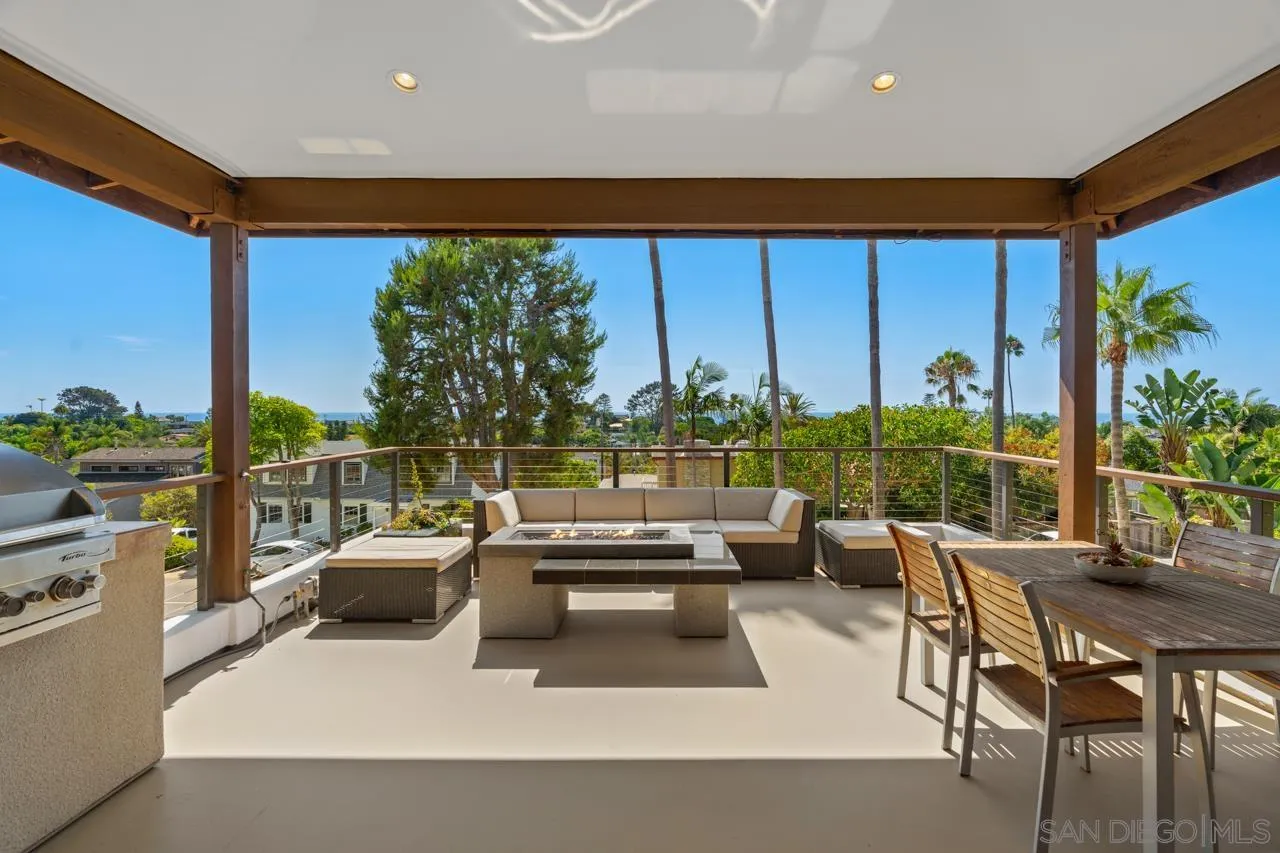 733 Stratford Drive Encinitas, CA 92024 - Photo 21 of 46 a view of a patio with a table and chairs