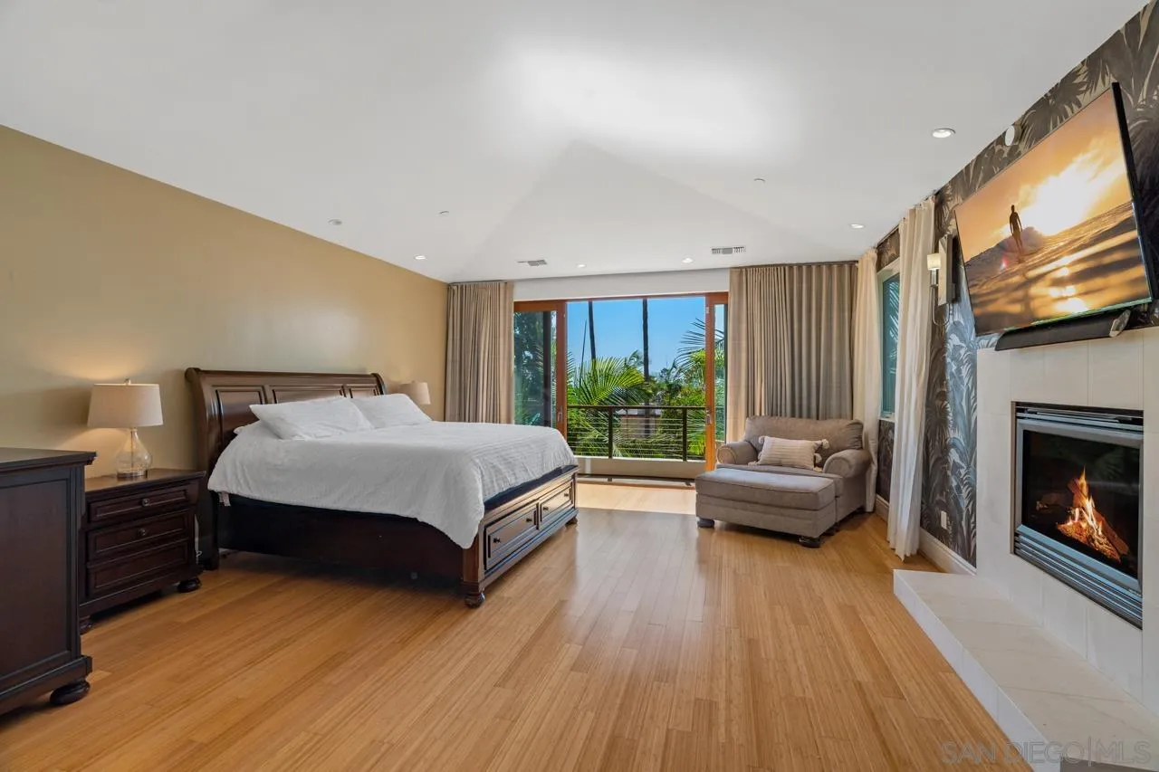 733 Stratford Drive Encinitas, CA 92024 - Photo 24 of 46 a spacious bedroom with a bed and wooden floor