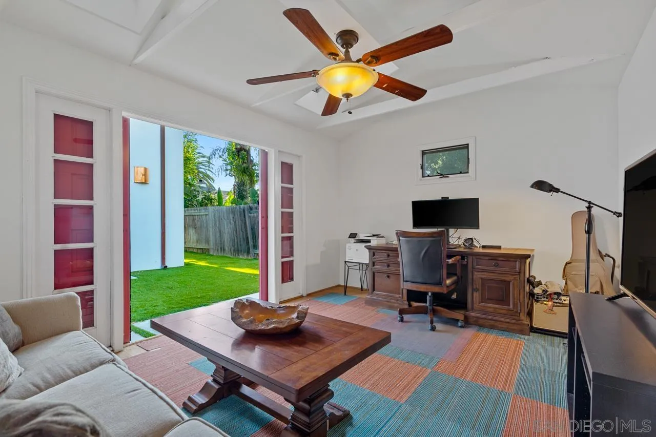 733 Stratford Drive Encinitas, CA 92024 - Photo 40 of 46 a living room with furniture and a flat screen tv